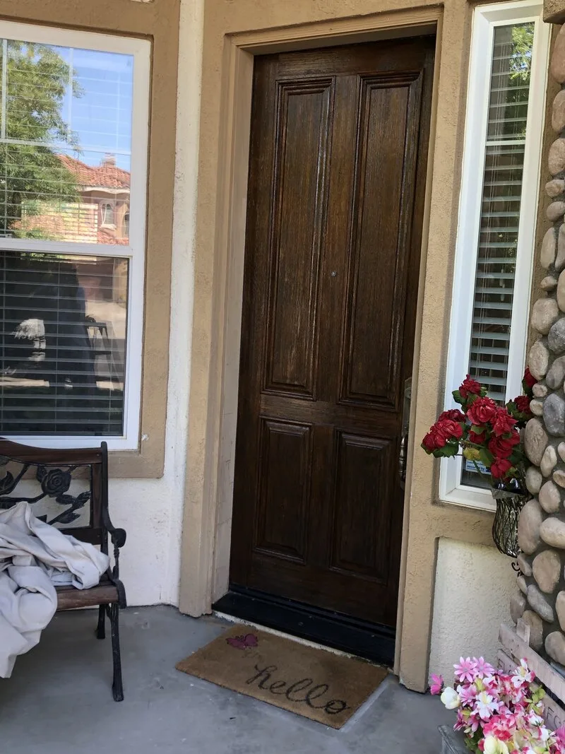 Front door after staining, refinished dark brown